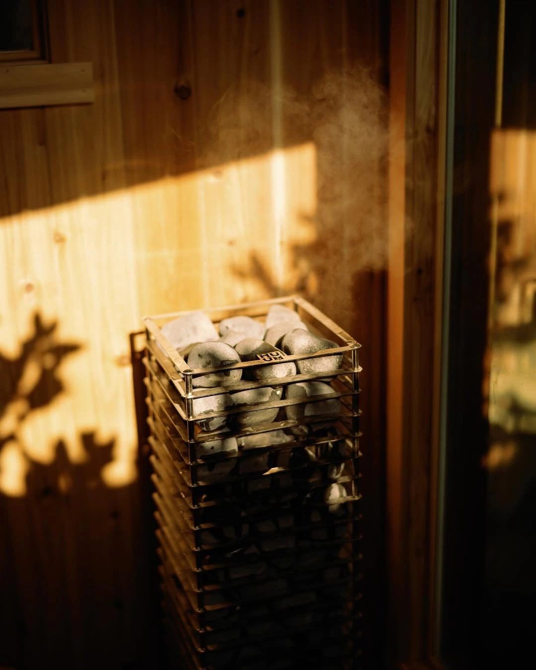Sauna heater with stones in the sunlight