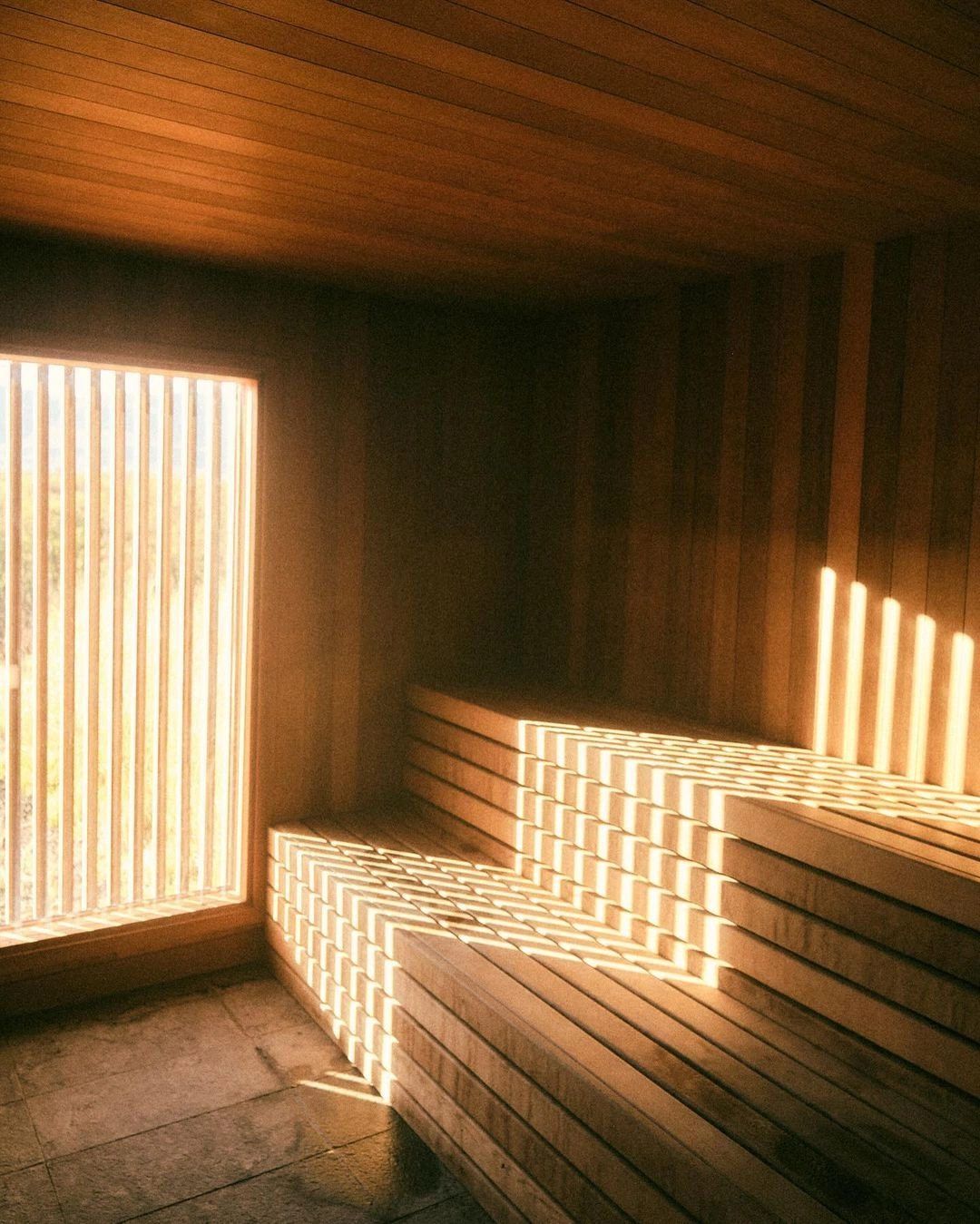 Sunlight falling through a window onto the sauna benches