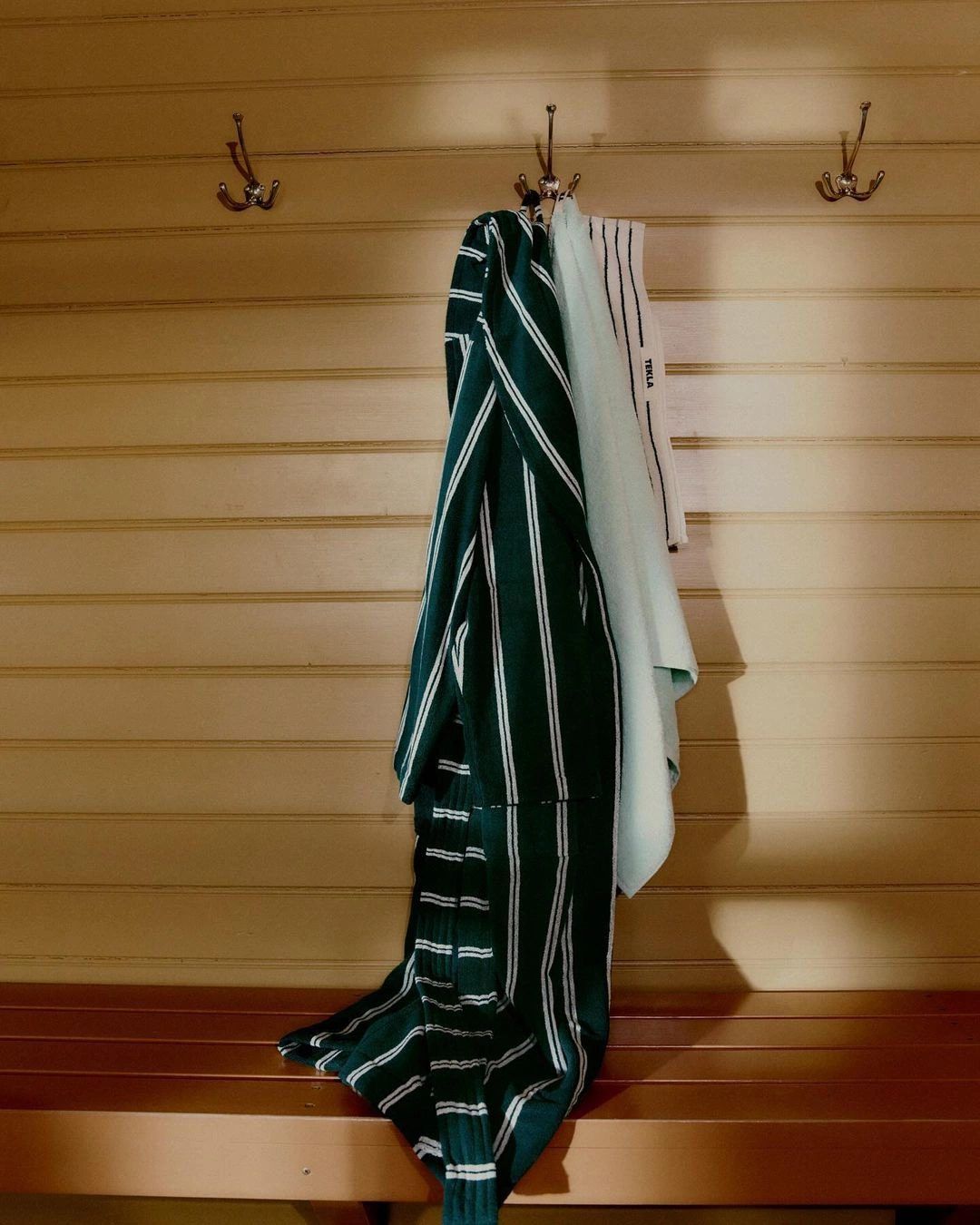 Striped towel on a hook in the sauna